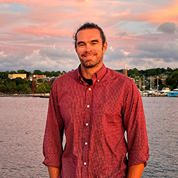 Derrick Mason by the waterfront at sunset